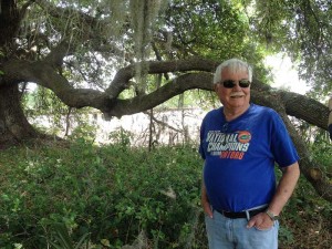 Terry Hadley standing next to an oak tree that was preserved on the farm.